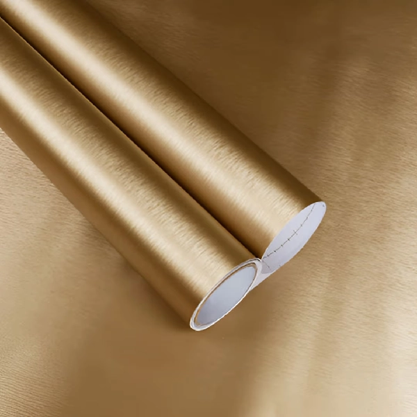 A roll of brushed gold metallic vinyl wrap.