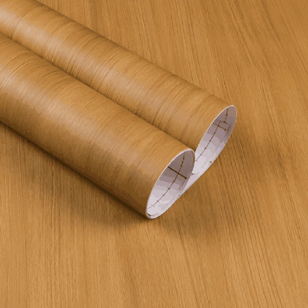 A roll of golden-brown wood grain patterned vinyl wrap.