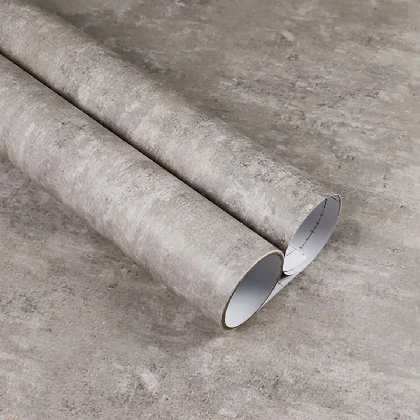 A roll of gray concrete or stone-textured vinyl wrap.