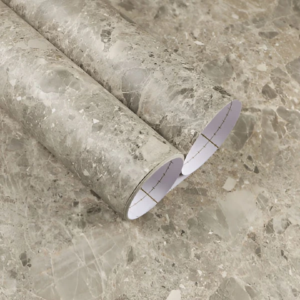 A roll of gray marble patterned vinyl wrap.