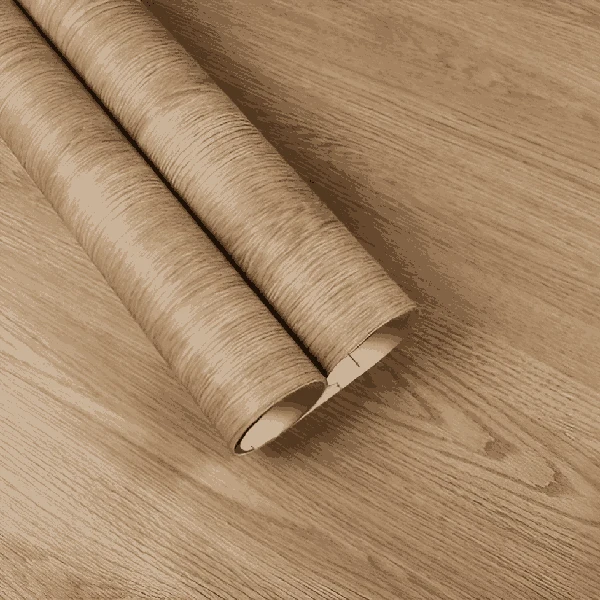 A roll of light brown wood grain patterned vinyl wrap. (1)