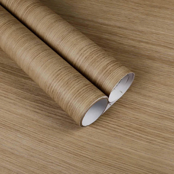 A roll of light brown wood grain patterned vinyl wrap.