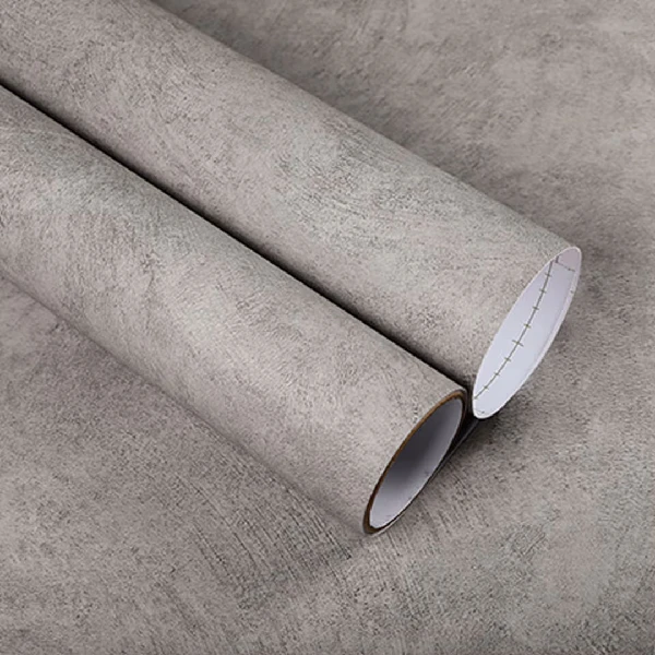 A roll of light gray concrete or stone-textured vinyl wrap. (2)
