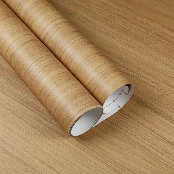 A roll of medium brown wood grain patterned vinyl wrap.