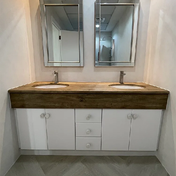 Bathroom with a white vanity and a dark woodgrain vinyl wrap