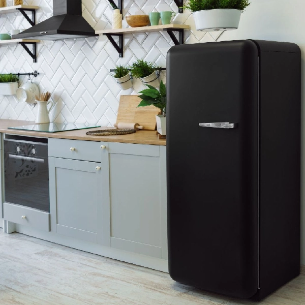 Black appliance vinyl wrap on a refrigerator.
