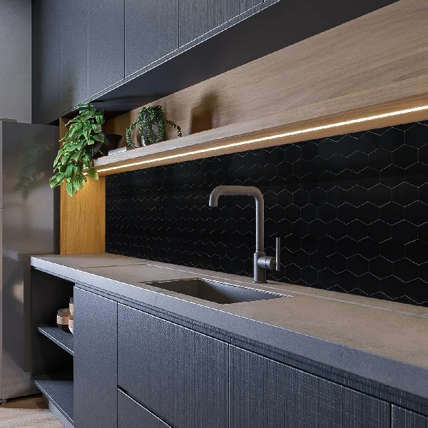 Black honeycomb-patterned vinyl wrap on a kitchen backsplash.