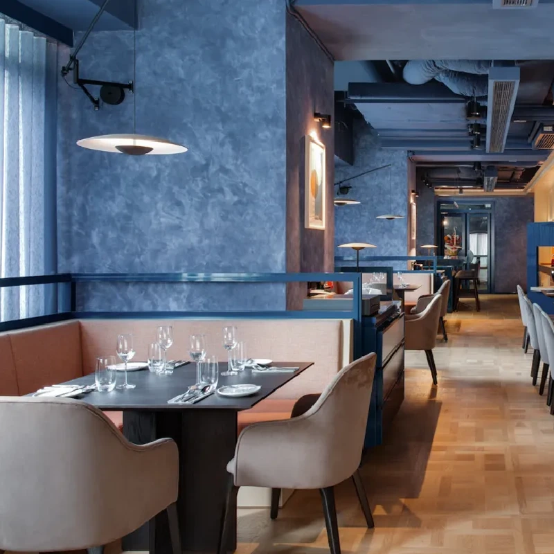 Dark blue textured wall vinyl wrap in a restaurant dining area.