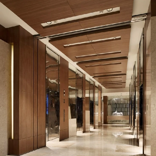 Elegant hotel wrapping with a woodgrain vinyl wrap on the walls and ceiling.