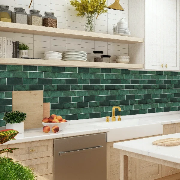Green subway tile-patterned vinyl wrap on a kitchen backsplash.