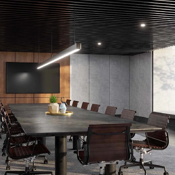 Grey concrete-patterned vinyl wrap on a conference room wall.