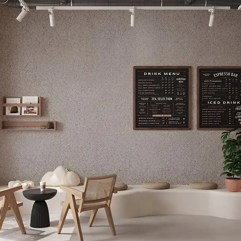 Grey wall with a textured, stone-like vinyl wrap.