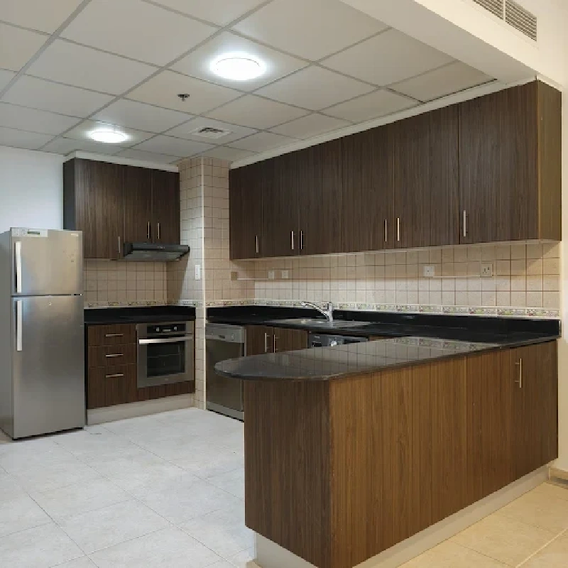 Light-brown wood grain vinyl wrap on a kitchen island.