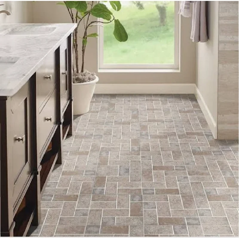 Luxury vinyl tile flooring with a rectangular tile pattern in shades of gray and brown