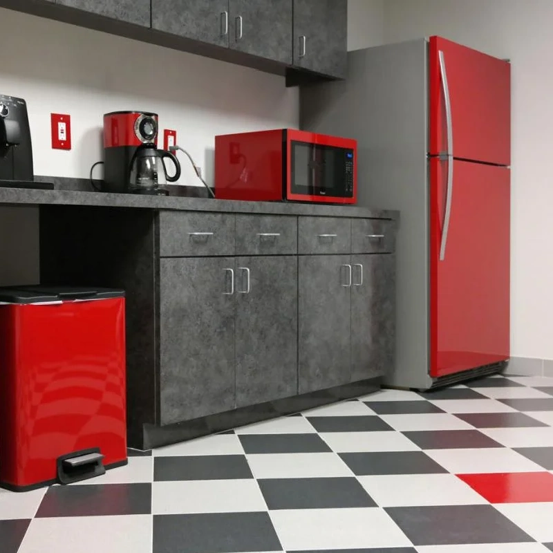 Red appliance vinyl wrap on a microwave, coffee maker, and refrigerator