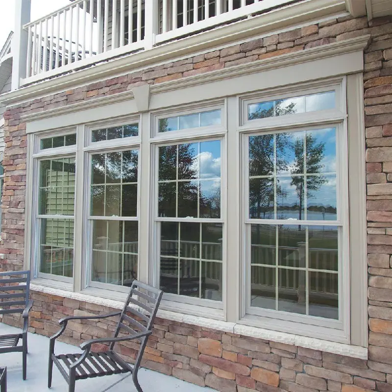 Tan window frame wrap with a white grid and clear glass looking out to a patio