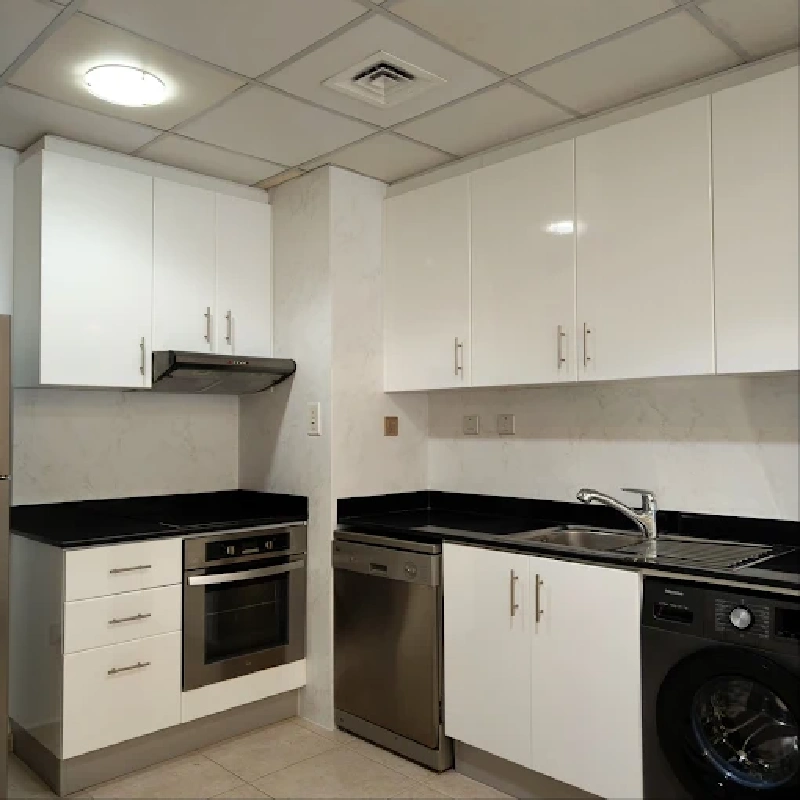 White and gray marble-look vinyl wrap on a kitchen wall.