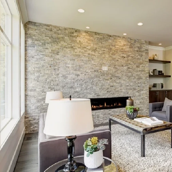 White and gray stone-look vinyl wrap on a fireplace wall.