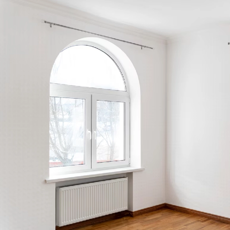 White arch-top window frame vinyl wrap with a heater underneath
