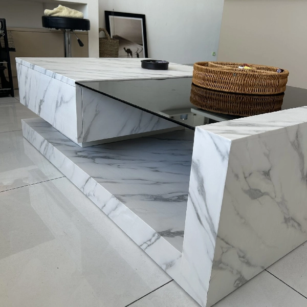 White marble-look vinyl wrap on a modern coffee table.