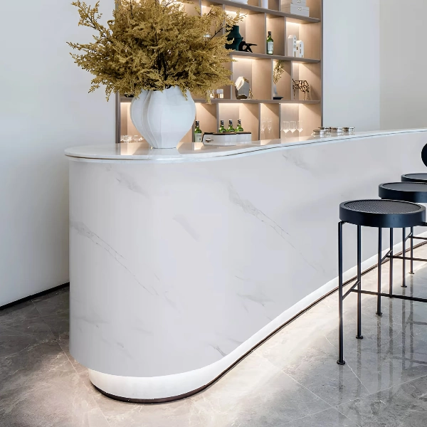 White marble pattern vinyl wrap on a bar counter in a restaurant.