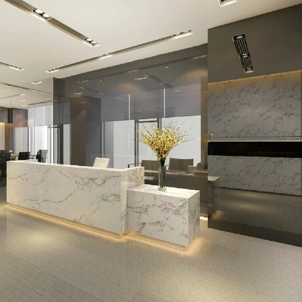 White marble-patterned vinyl wrap on a reception desk and wall.