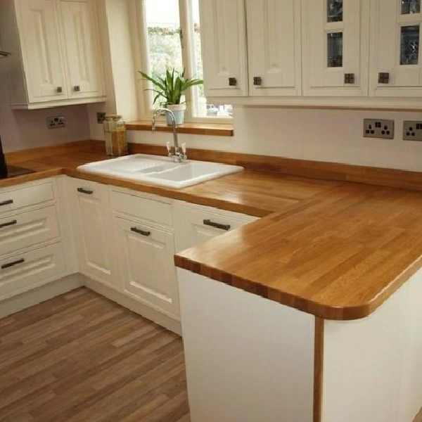 Wood-grain patterned vinyl wrap on a kitchen counter.