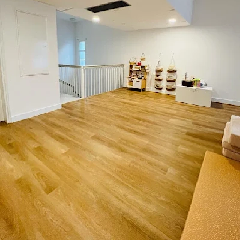 Wooden plank vinyl flooring in a kitchen area.