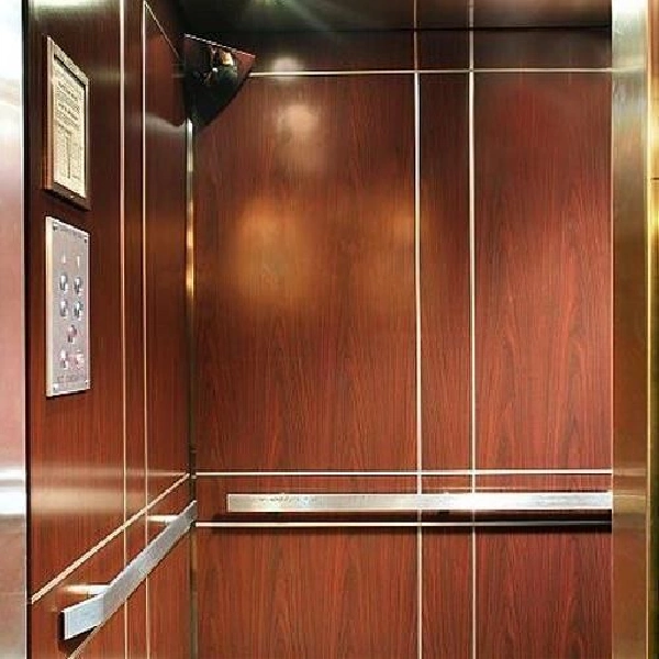 Woodgrain vinyl wrap inside an elevator.