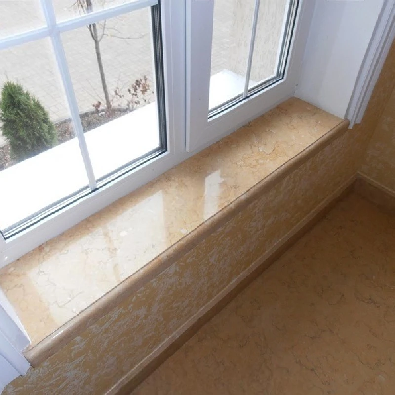 marble windowsill with a smooth, polished surface and a rounded edge.