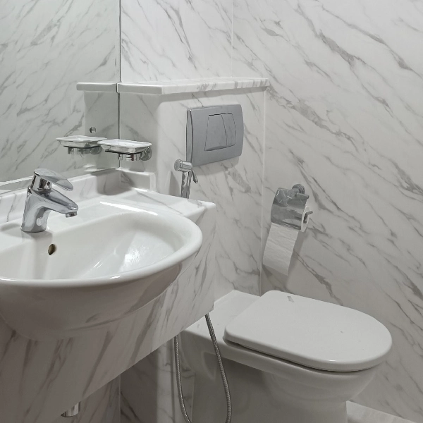 white marble vinyl wrap on bathroom walls.