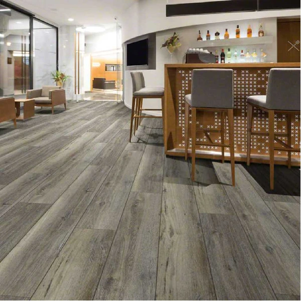 Gray wood-look plank flooring in a modern bar