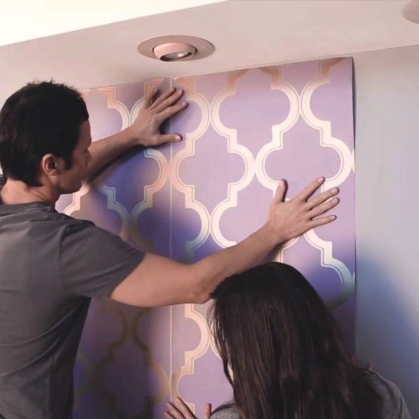 hang a large sheet of purple and gold patterned wallpaper.
